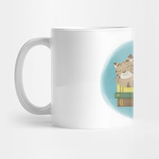 Cute cat sleeping on books Mug